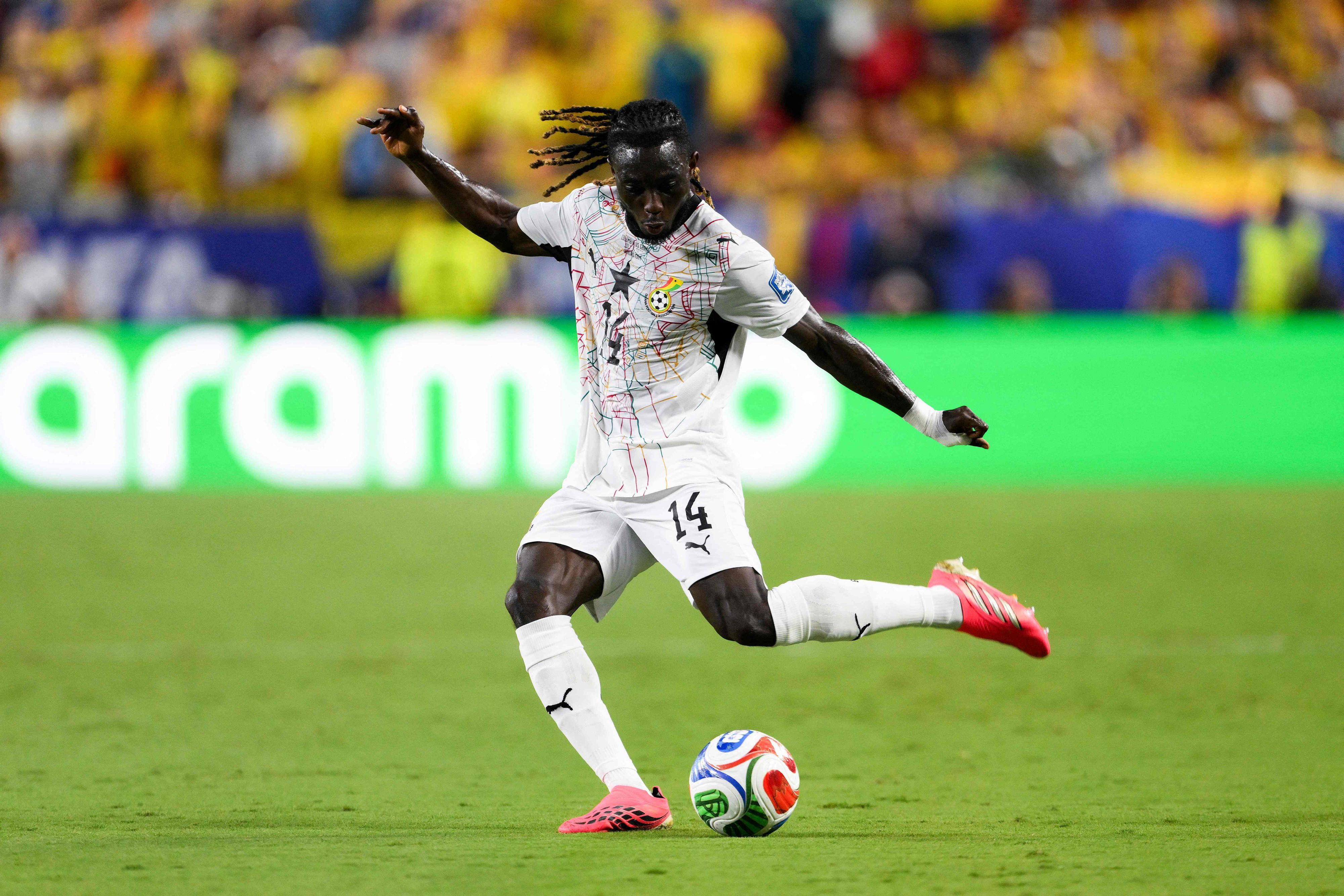 KANSAS CITY, MISSOURI - JULY 03: Gideon Mensah #14 of Ghana runs with the ball during the FIFA World Cup 2026 Round Of 32 match between Group K Winner and Group D/E/I/J/L Third Place at Kansas City Stadium on July 03, 2026 in Kansas City, Missouri.   David Ramos/Getty Images/AFP (Photo by David Ramos / GETTY IMAGES NORTH AMERICA / Getty Images via AFP)