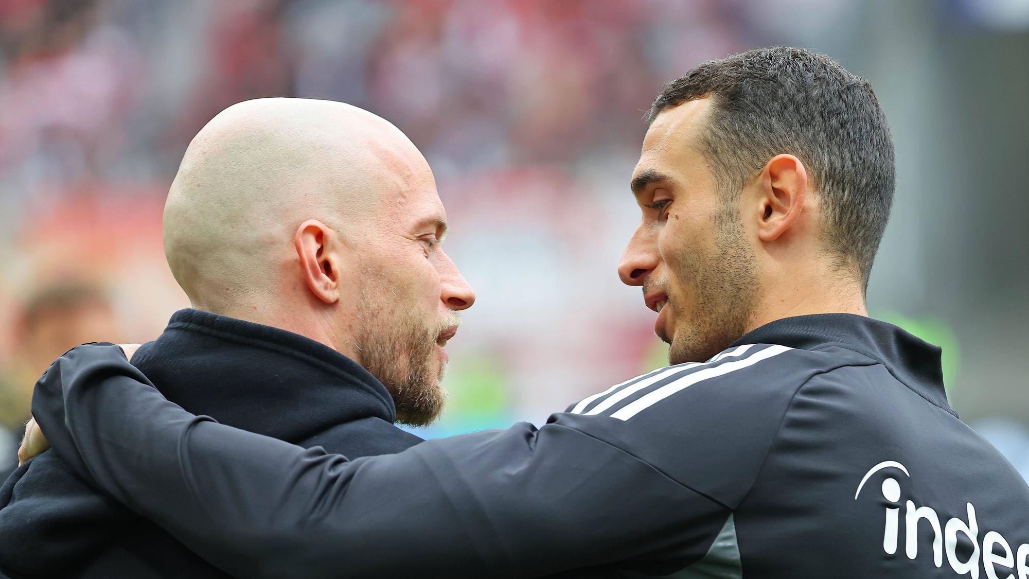 Frankfurt, Deutschland 05. April 2026: 1.Bundesliga - 2025/2026 - Eintracht Frankfurt gegen 1. FC Köln Im Bild: v.li. Trainer Rene Wagner 1.FC umarmt freundschaftlich Ellyes Skhiri Frankfurtkurz vor Spielbeginn. /// DFL regulations prohibit any use of photographs as image sequences and/or quasi-video /// Deutsche Bank Park Hessen *** Frankfurt, Germany 05 April 2026 1 Bundesliga 2025 2026 Eintracht Frankfurt vs 1 FC Köln In the picture from left coach Rene Wagner 1 FC hugs friendly Ellyes Skhiri Frankfurt shortly before the start of the match DFL regulations prohibit any use of photographs as image sequences and or quasi video Deutsche Bank Park Hessen Copyright: xFotostandx/xRacochax