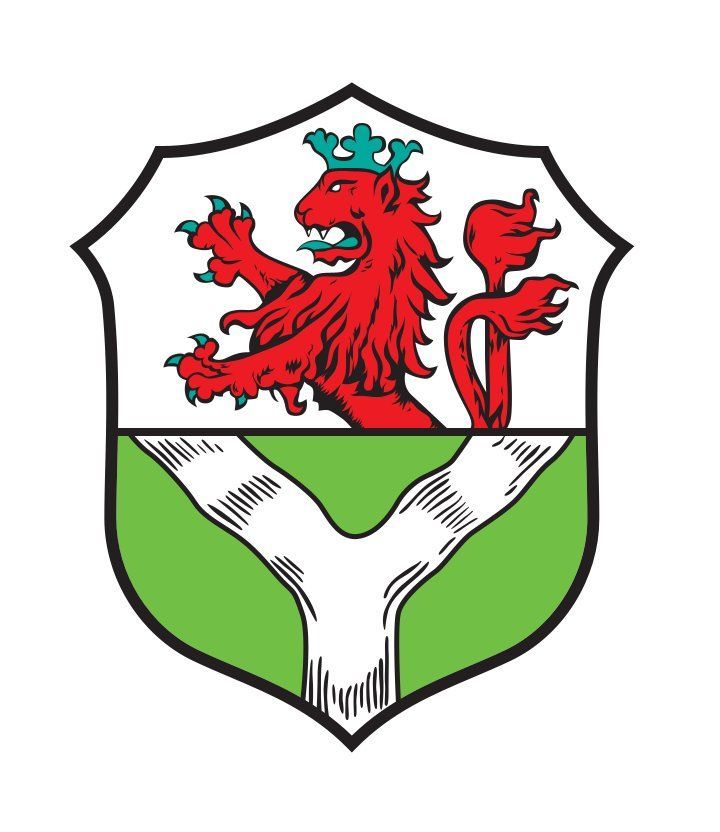 Beim zweigeteilten Wappen der Stadt Lohmar befindet sich oben ein Bergischer Löwe und unten eine Y-förmige Auslassung.