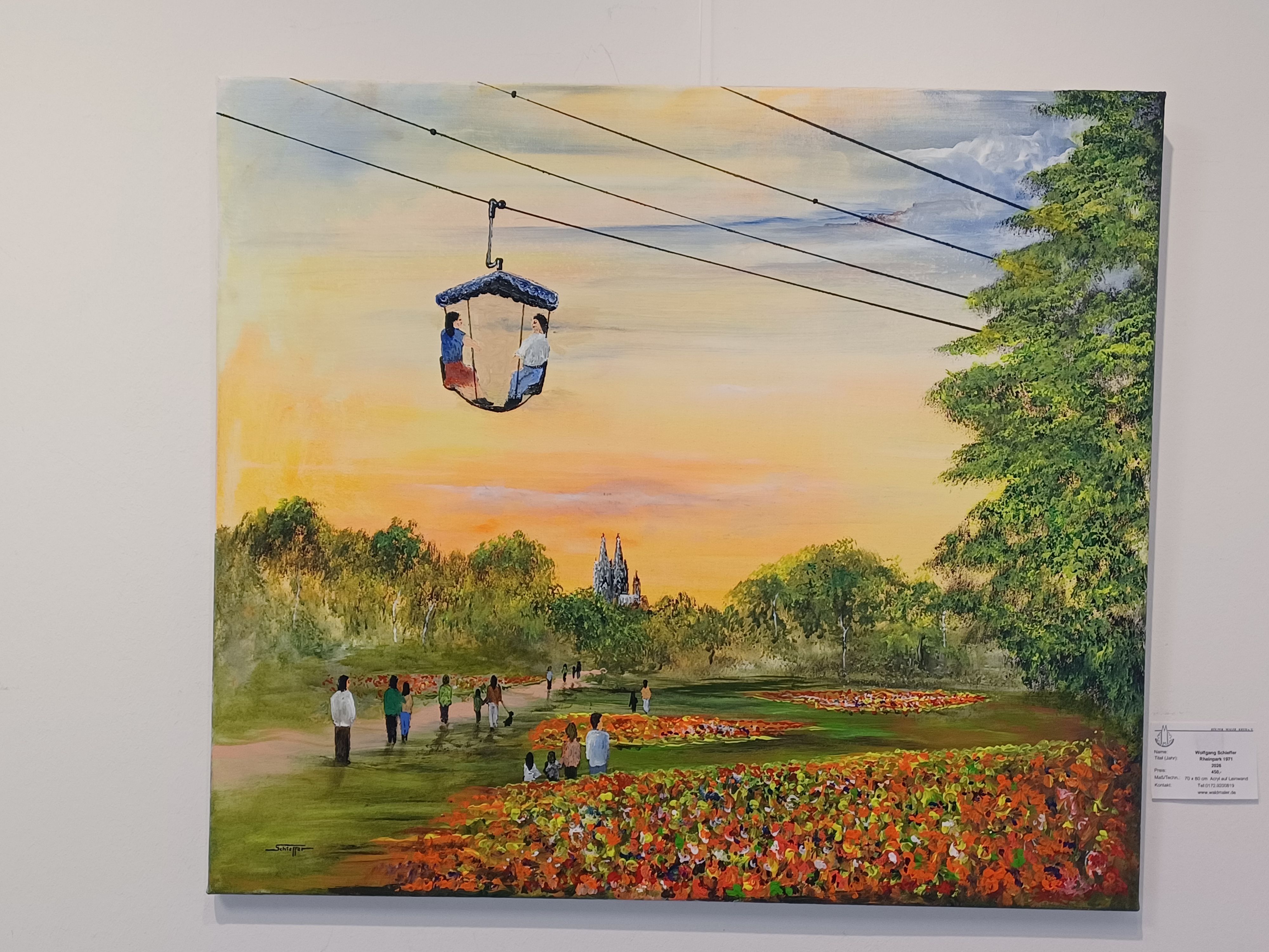 Ein Bild von Wolfgang Schieffer aus der Jubiläumsschau zeigt den Rheinpark in harmonischer Abendstimmung.