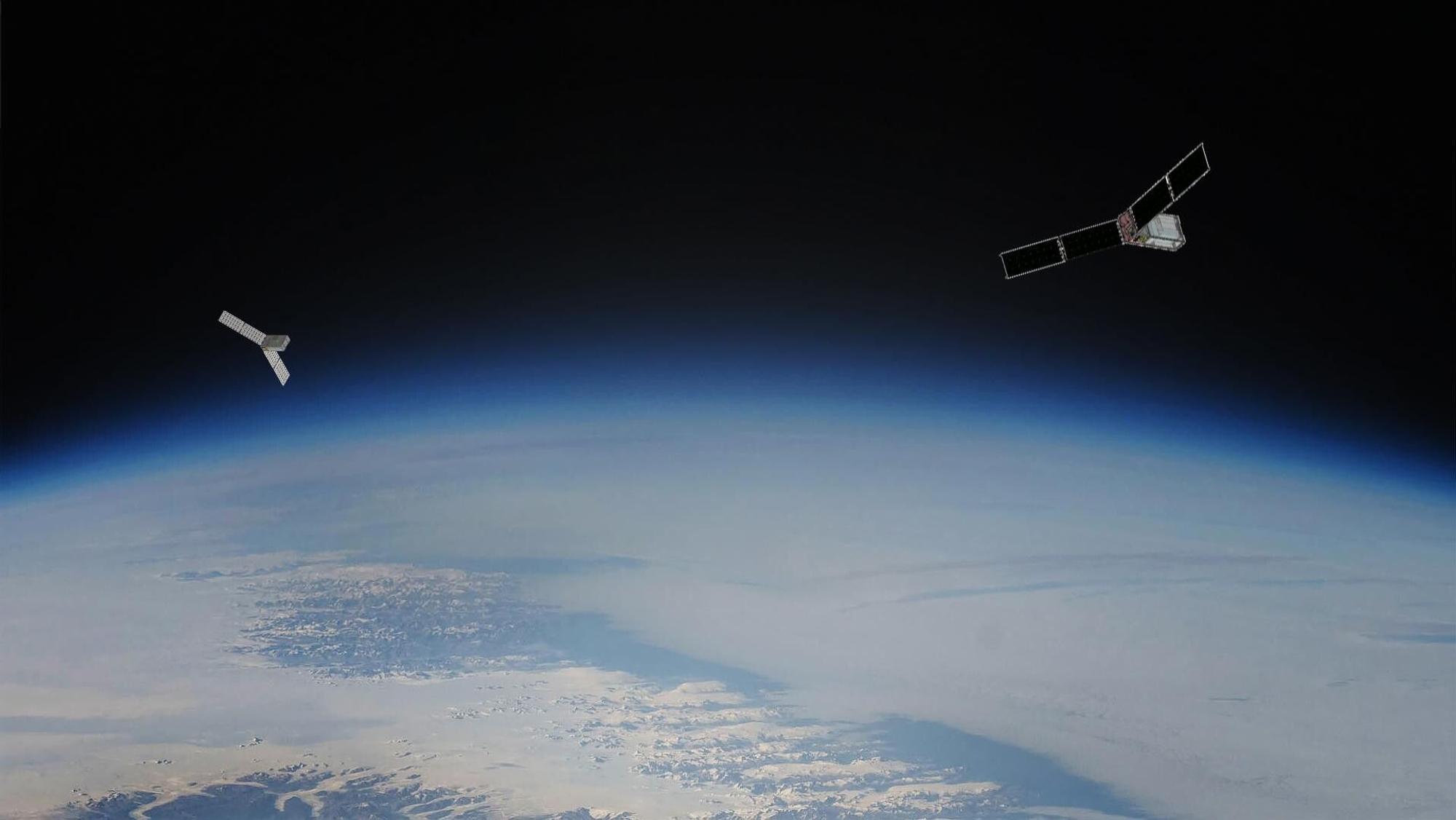 Zwei Satelliten schweben über der Erde.