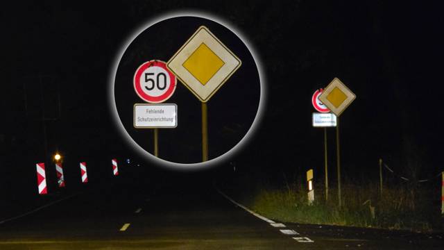 In der Nacht sind Schilder an der Dürschtalstraße bei Kürten-Dürscheid zu sehen.