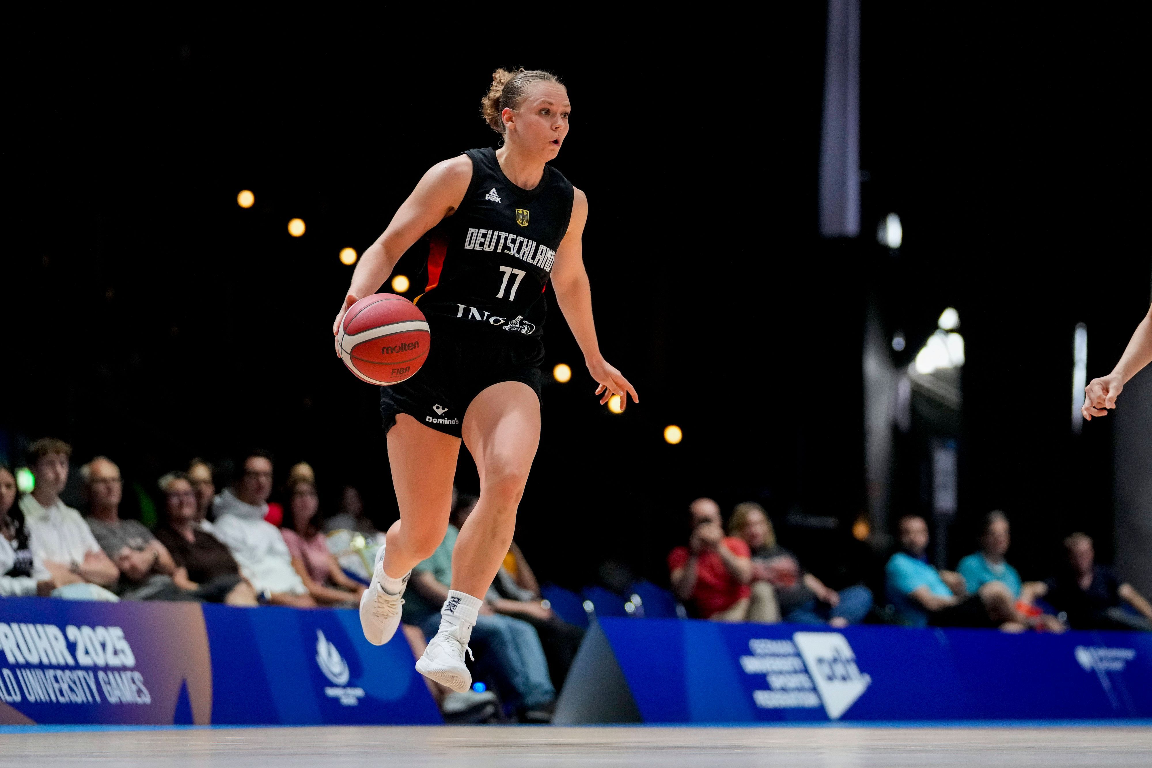 Franka Wittenberg Germany controls the ball during the women s basketball match in the group phase between Chinese Taipei and Germany on Day 5 of the FISU World University Games Rhine-Ruhr at Grugahalle on July 20, 2025 in Essen, Germany. Photo by Alex Gottschalk/DeFodi Images *** Franka Wittenberg Germany controls the ball during the women s basketball match in the group phase between Chinese Taipei and Germany on Day 5 of the FISU World University Games Rhine Ruhr at Grugahalle on July 20, 2025 in Essen, Germany Photo by Alex Gottschalk DeFodi Images
