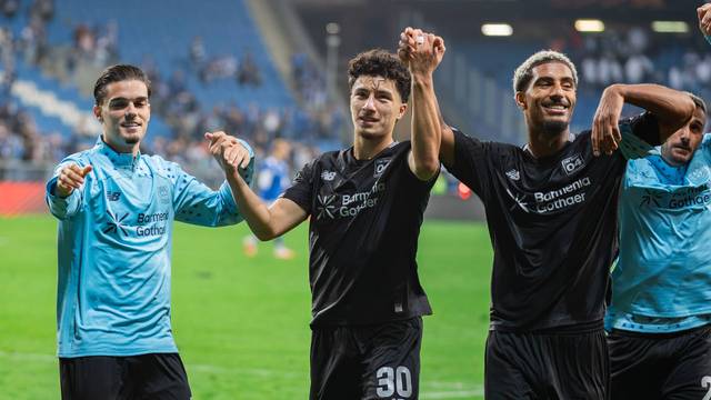 October 15, 2026, Poznan, Poland: Miguel Gutierrez L, Ibrahim Maza C and Loic Bade R of Bayer celebrate a win during the UEFA Europa League match between Lech Poznan and Bayer 04 Leverkusen at Enea Stadium Poznan. Final score Lech Poznan 0:4 Bayer 04 Leverkusen. Poznan Poland - ZUMAs197 20261015_aaa_s197_300 Copyright: xMikolajxBarbanellx