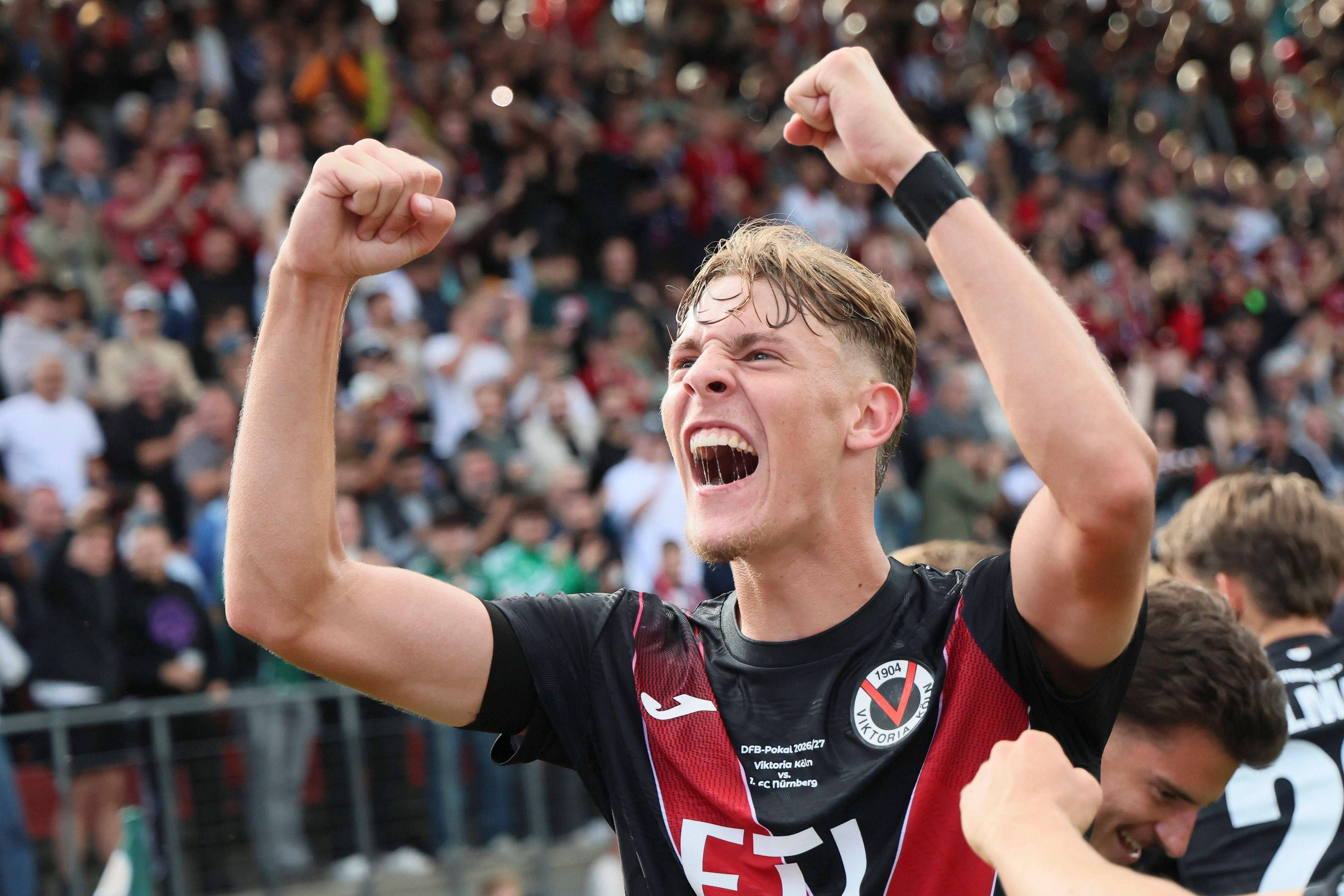 KOELN, GERMANY - AUGUST 22, 2026: Niklas Swider Viktoria Koeln, 20 celebrates the 1:1 after a goal of Meiko Sponsel Viktoria Koeln, 19 during the DFB-Cup match between Viktoria Koeln vs. 1. FC Nuernberg at the Sportpark Hoehenberg on August 22, 2026 in Koeln, Germany. DFL REGULATIONS PROHIBIT ANY USE OF PHOTOGRAPHS AS IMAGE SEQUENCES AND/OR QUASI-VIDEO. Nordrhein-Westfalen Germany Copyright: xAxelxKohringx
