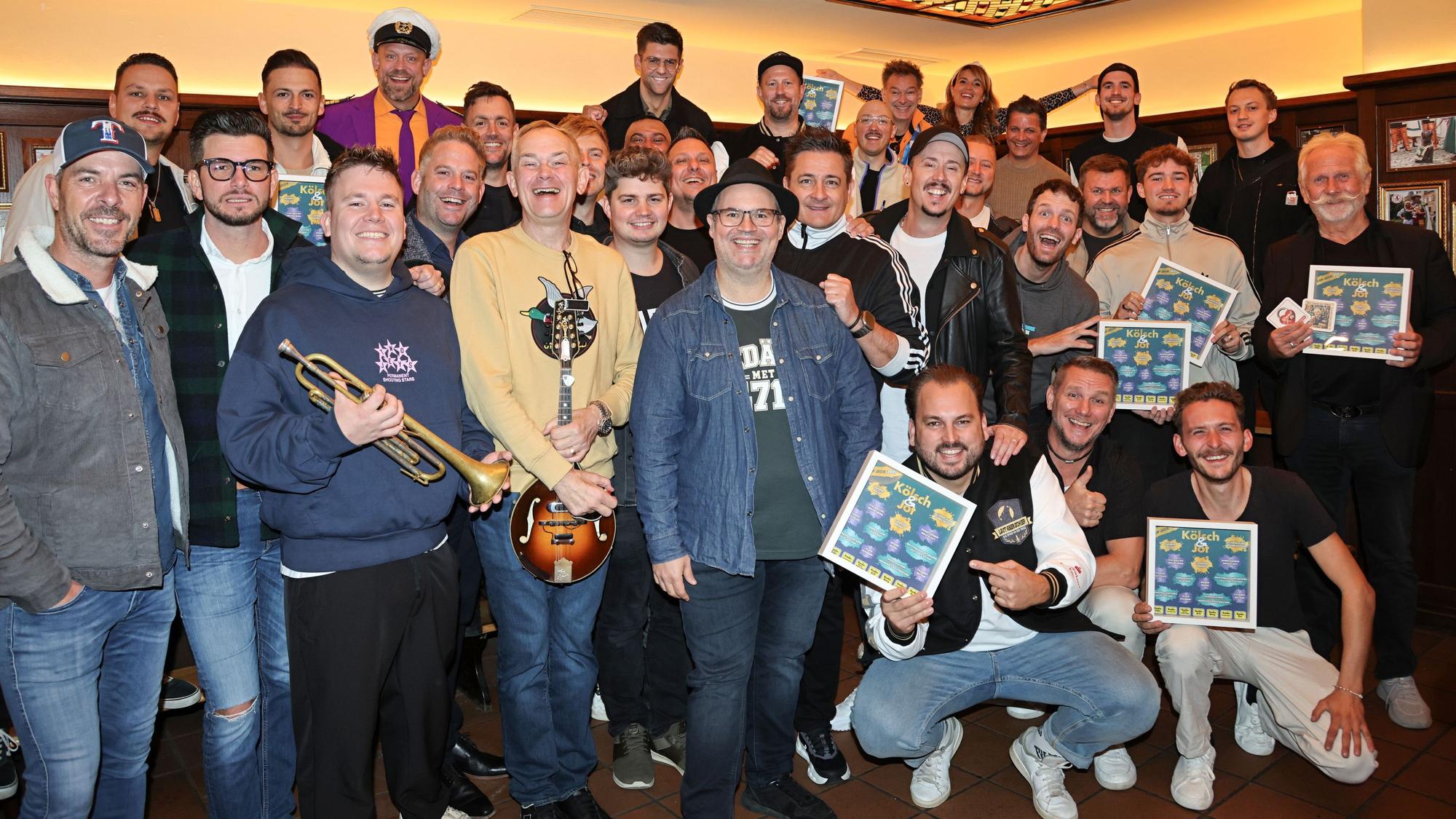 Gruppenbild der Musiker zur Sampler-Präsentation „Kölsch & Jot – Top Jeck 2027“.