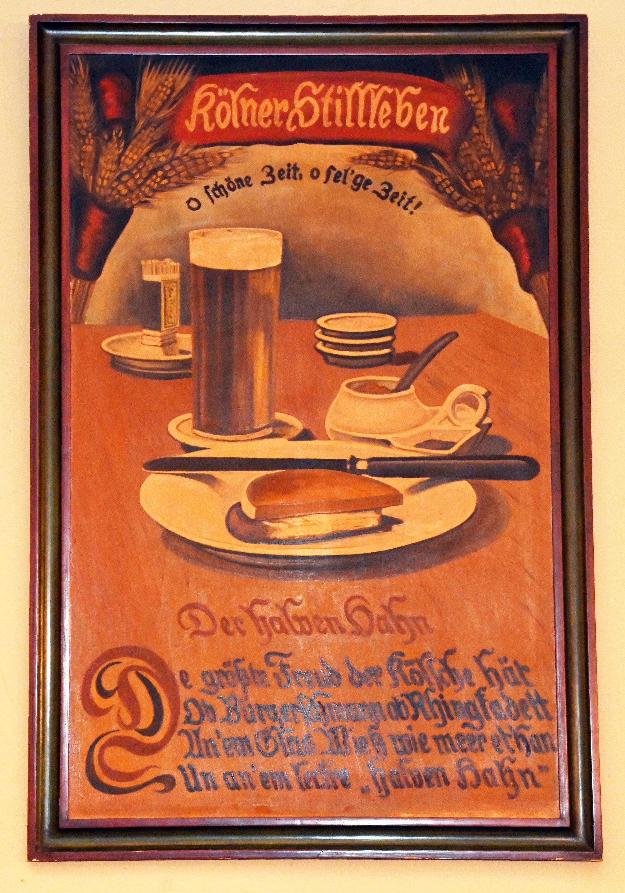 Im Brauhaus Früh am Dom hängt ein altes Gemälde, welches das klassische Brauhausgericht „Halve Hahn“ mit Brotscheiben zeigt.