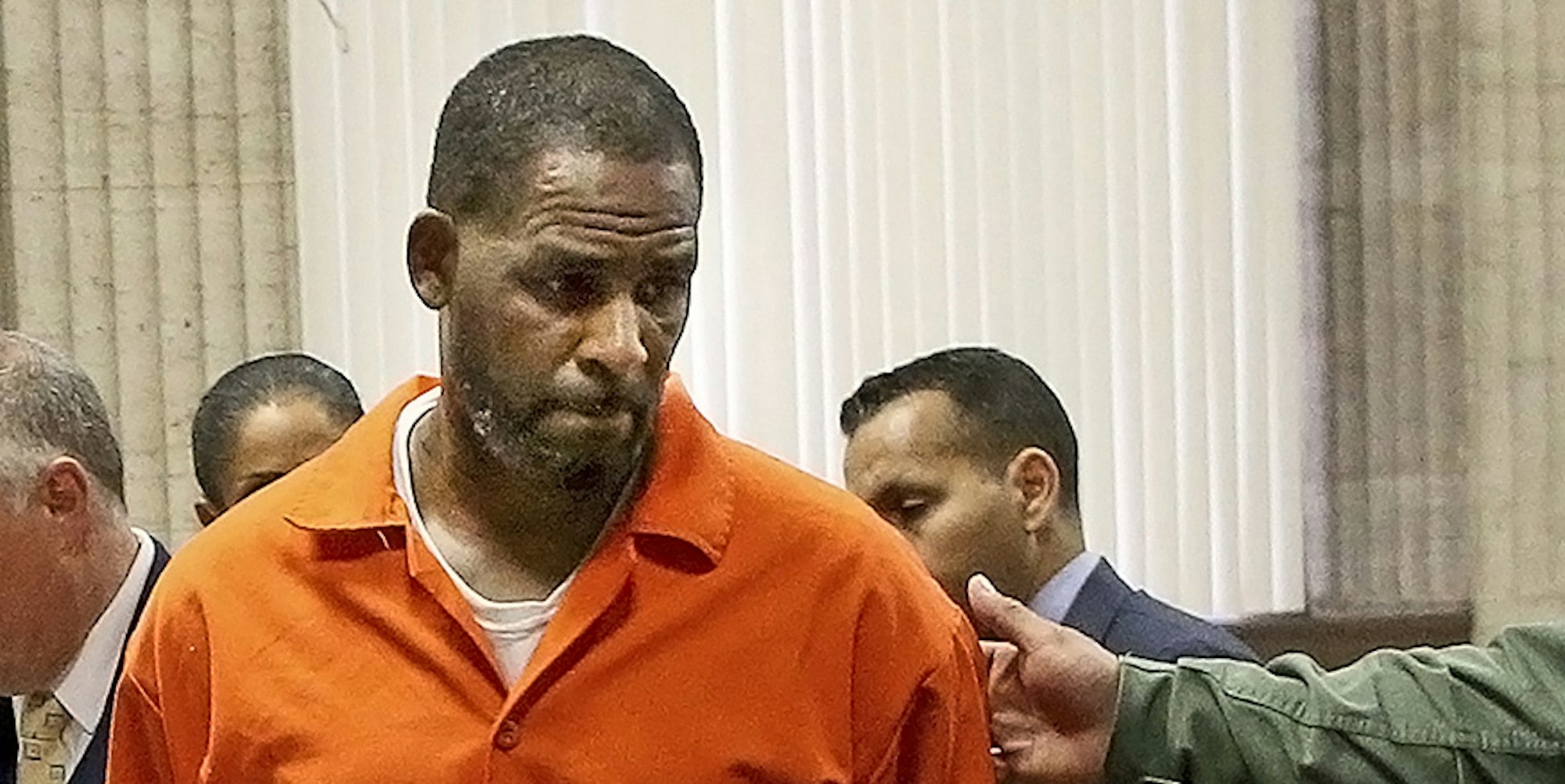 R Kelly orange jacket