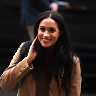 Meghan Markle lacht für die Fotografen.